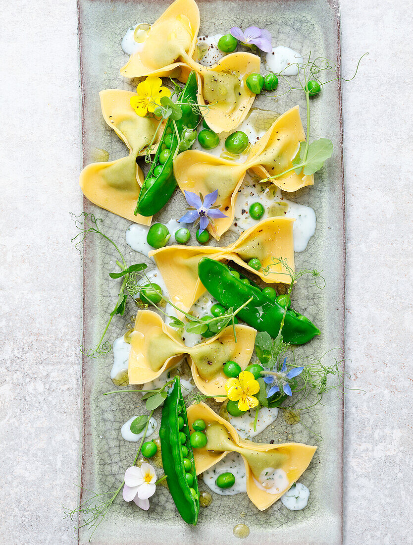 Farfalle with peas, pea sprouts and flowers