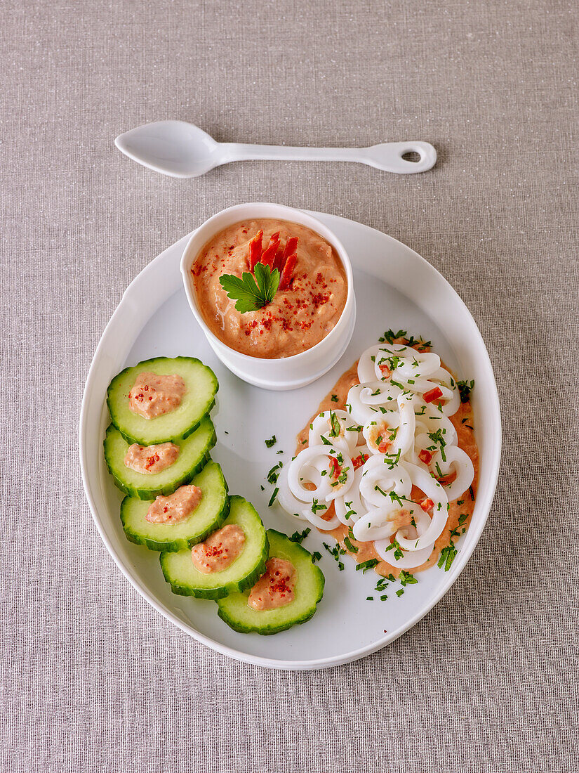 Calamari with chorizo dip and cucumber slices