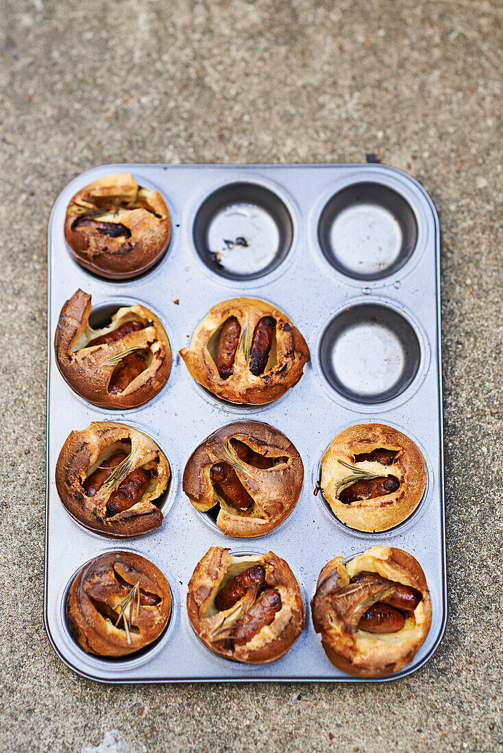Hearty muffins with sausages in a muffin tin