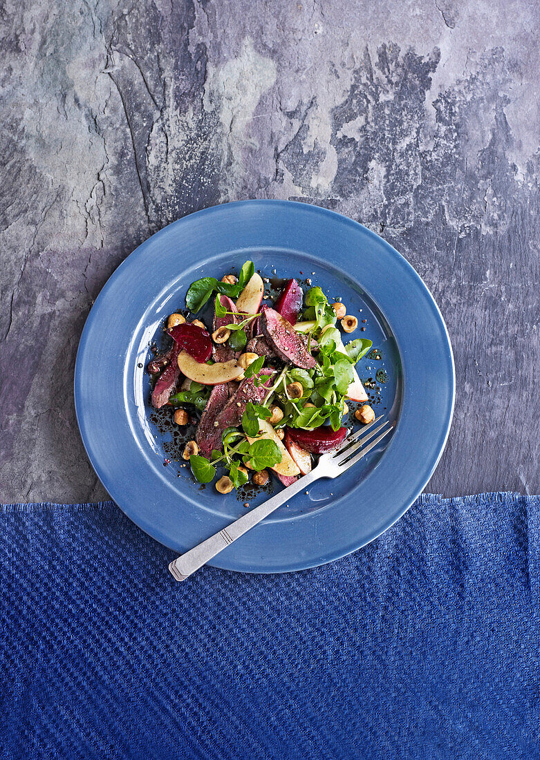 Pigeon and beetroot salad with hazelnuts