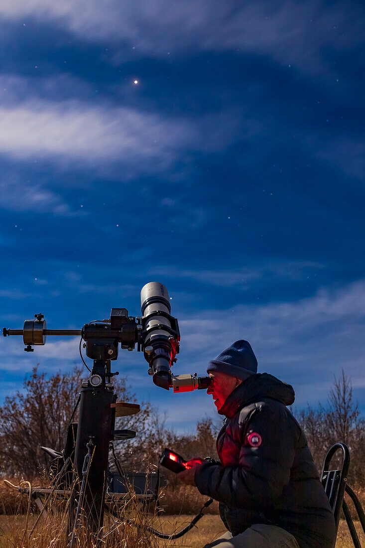 Astrophotographer observing Mars
