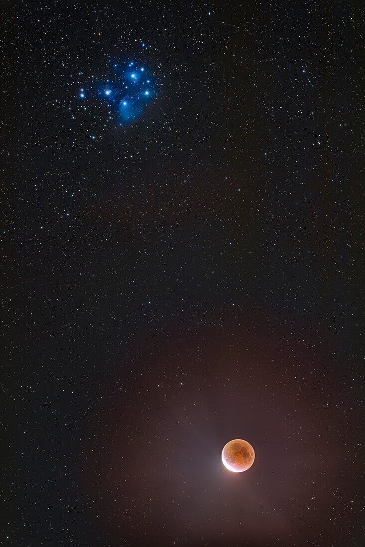 Eclipsed Moon below the Pleiades