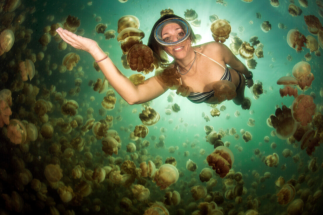 Diving woman in Jellyfish Lake, Eil Malk, Palau