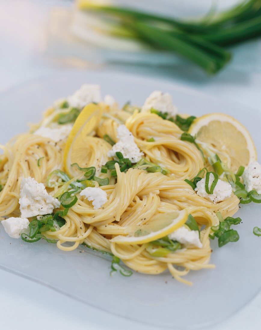 Spaghetti with spring onions and sheep's cheese