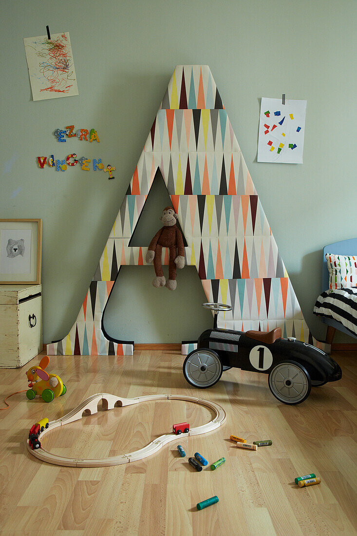 Letter shelf next to bed in children's room