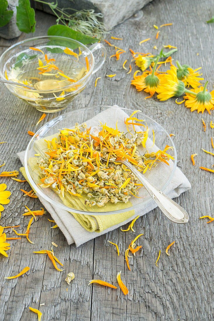 Dried marigold tea and camomile tea, with fresh flowers