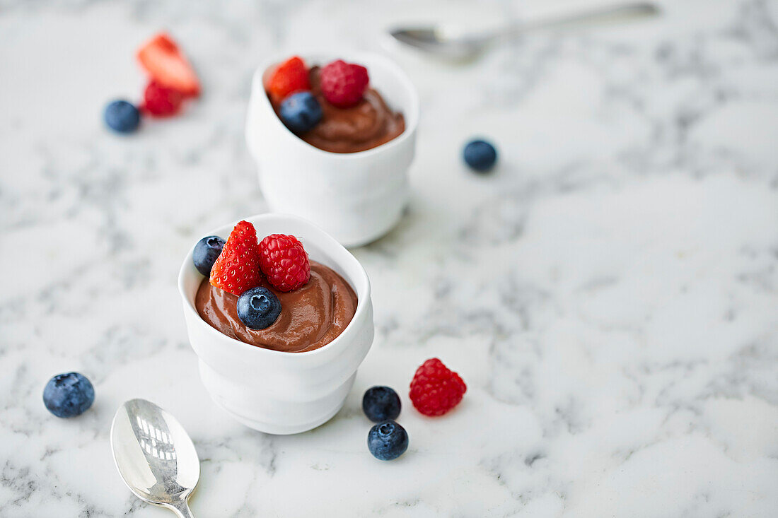 Chocolate mousse topped with strawberries, blueberries and raspberries