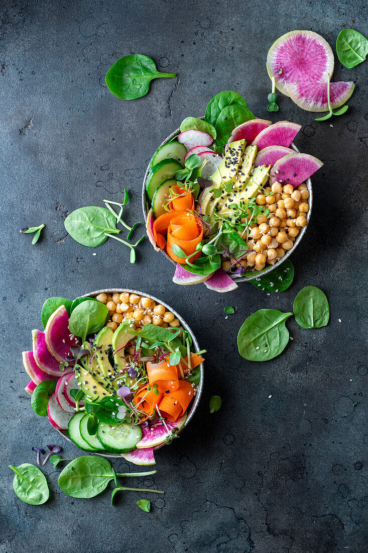 Watermelon radish salads with chick peas, radish, avocado and cucumber