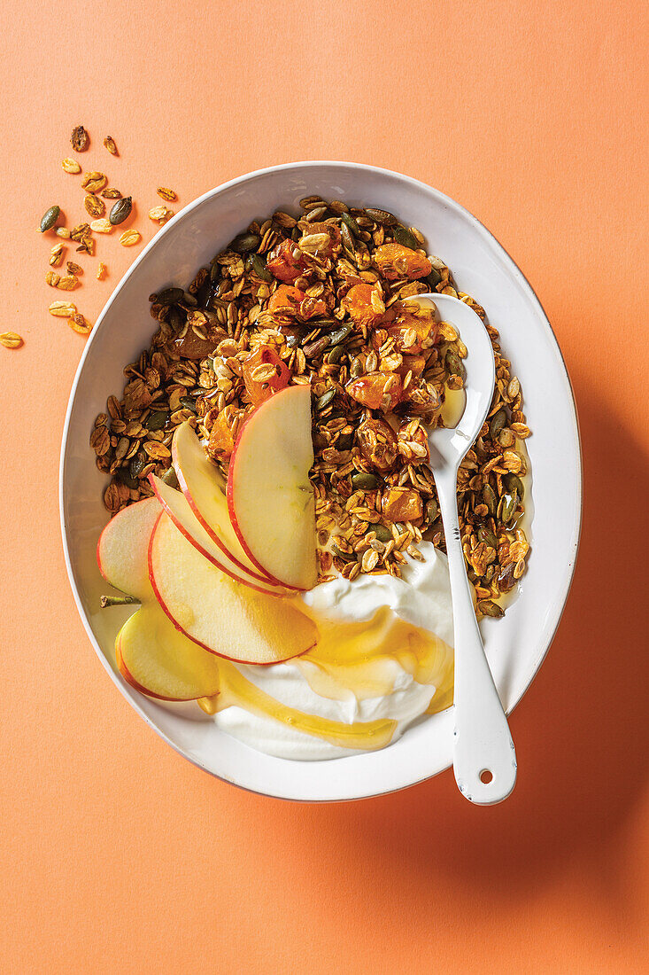 Homemade oat granola with apples and honey