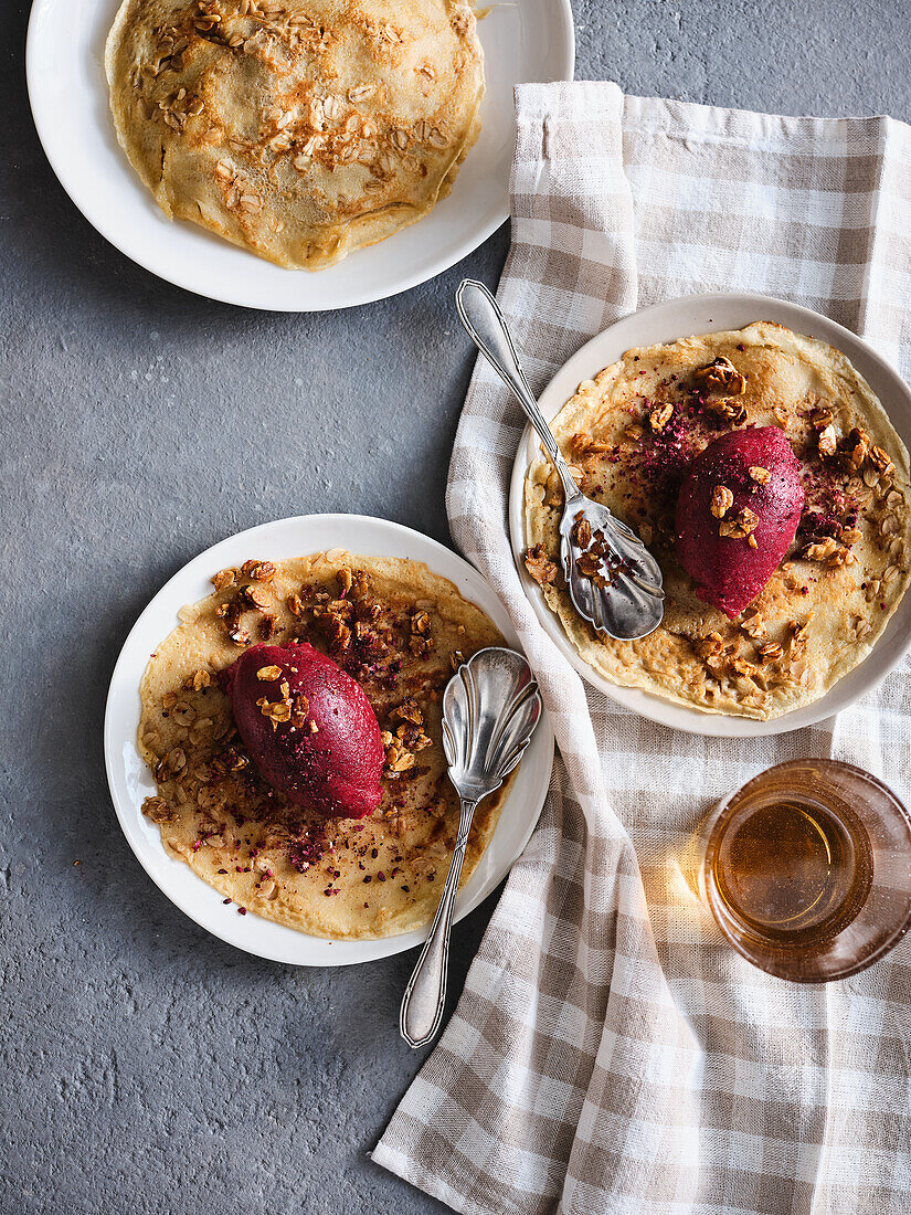 Gluten-free oat pancakes with blackberry sorbet and oatmeal