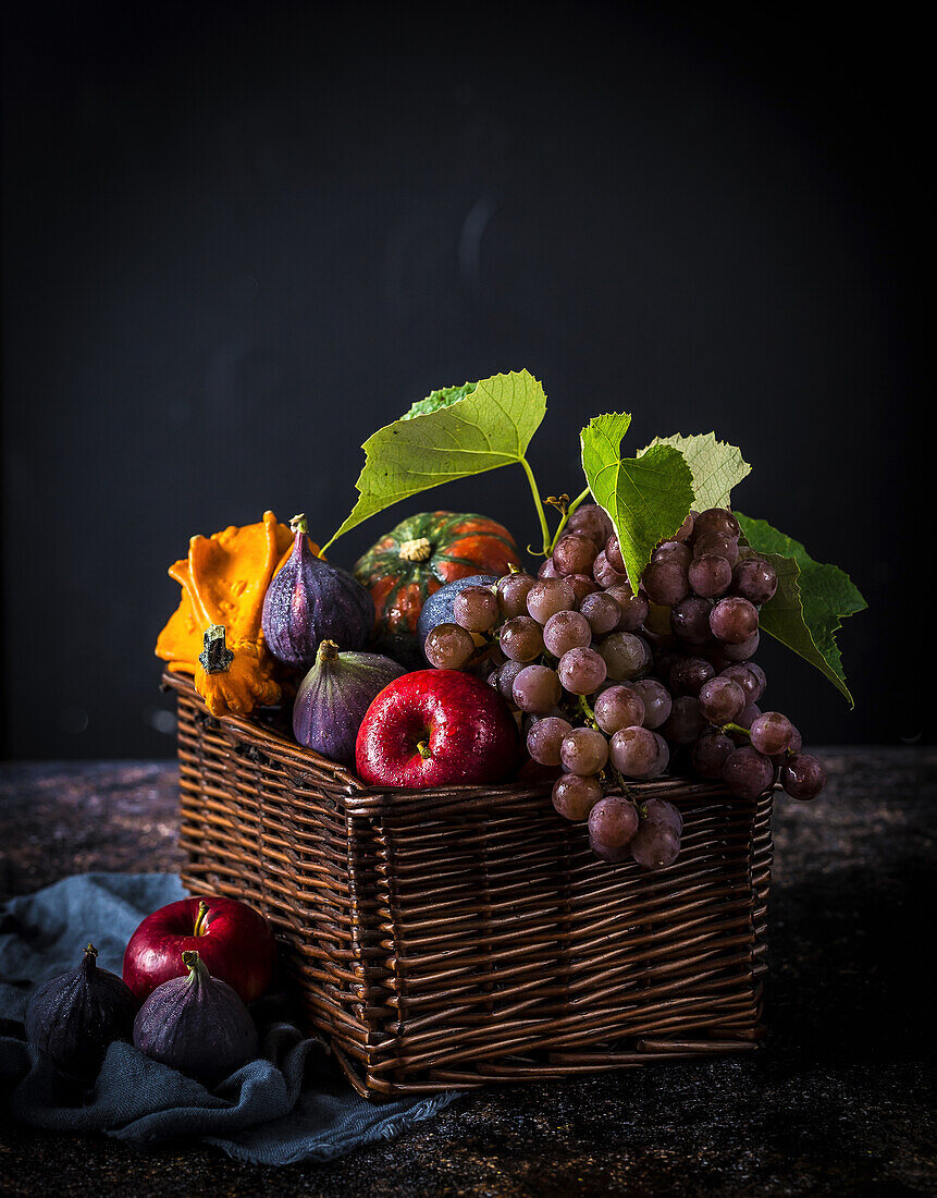 Autumn fruits in a wicker basket