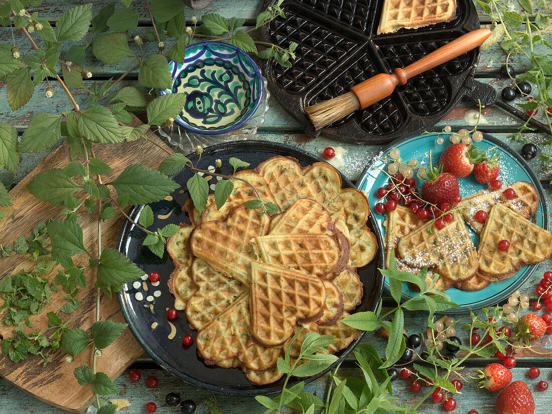 Herb waffle, waffles with berries, and a waffle iron