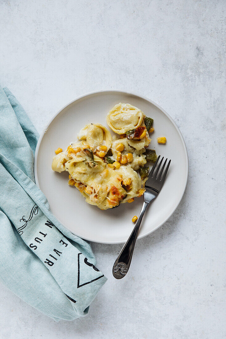 Vegetarian tortellini casserole with corn and peppers