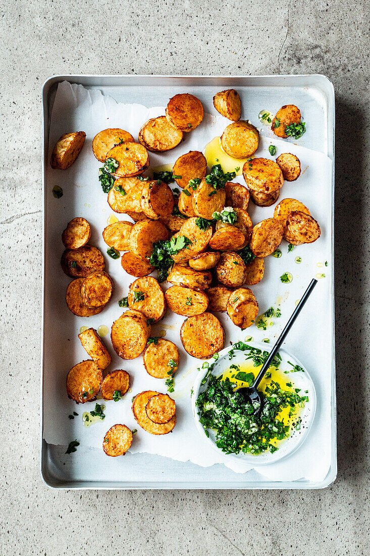 Sliced Baked potatoes with quick parsley garlic oil