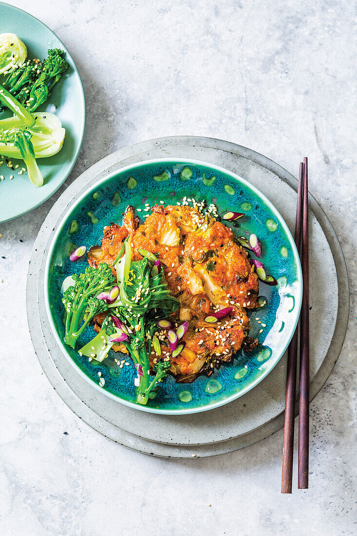Kimchi and rice pancakes with garlicky greens