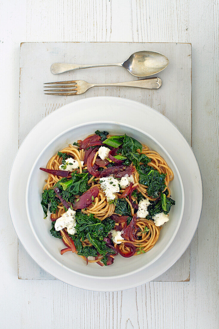 Spaghetti with caramelized onions, kale, and Gorgonzola cheese