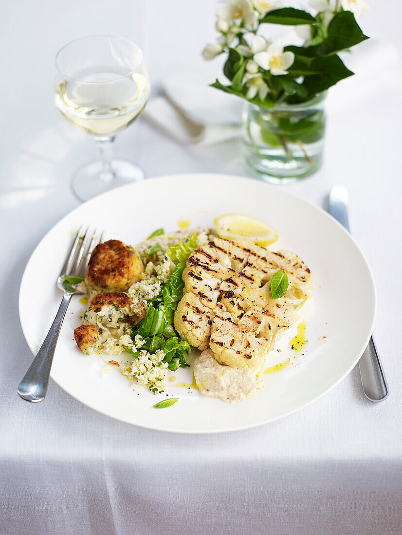 Cauliflower steaks with Greek meatballs (keftedes) and couscous