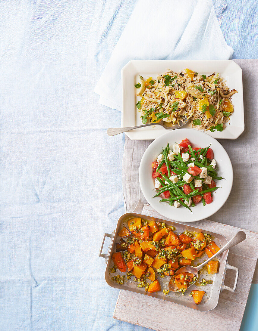 Wild rice with orange and fennel, roasted pumpkin with pistachios, beans with tomato and feta