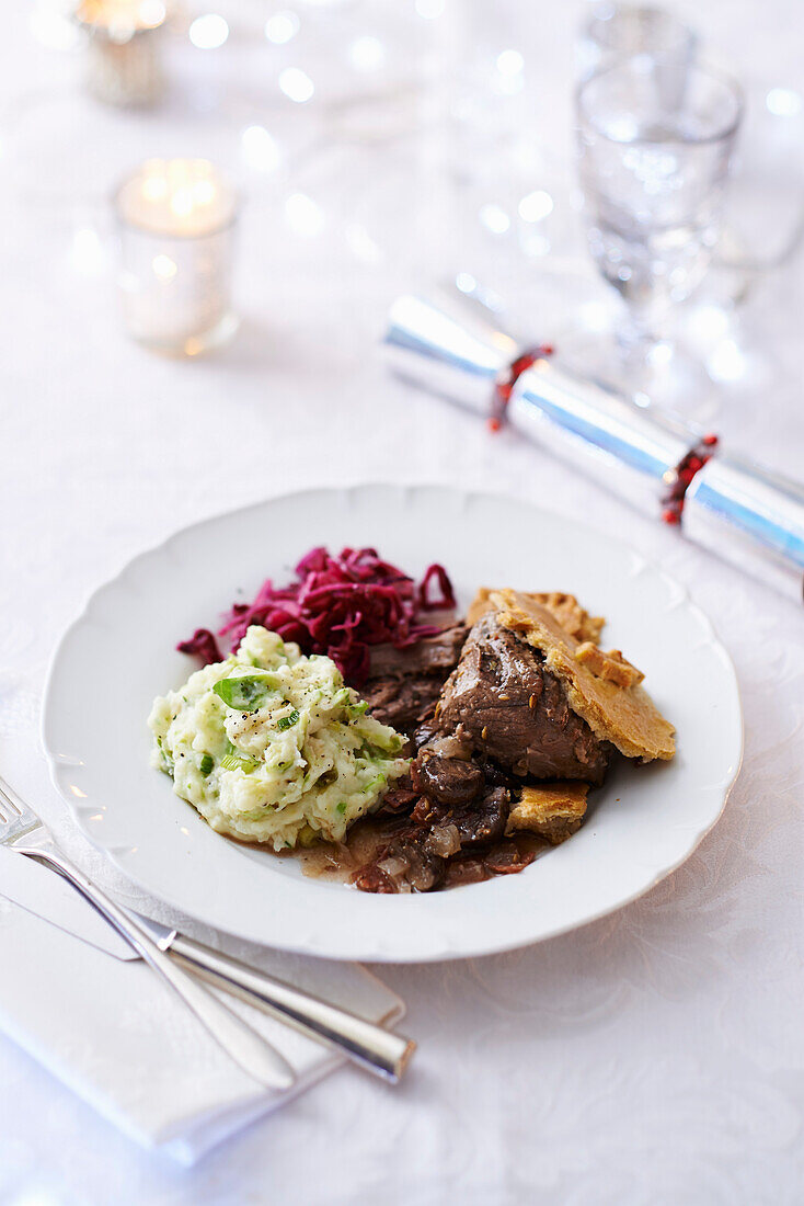 Festive feast pie with red cabbage and potato mash