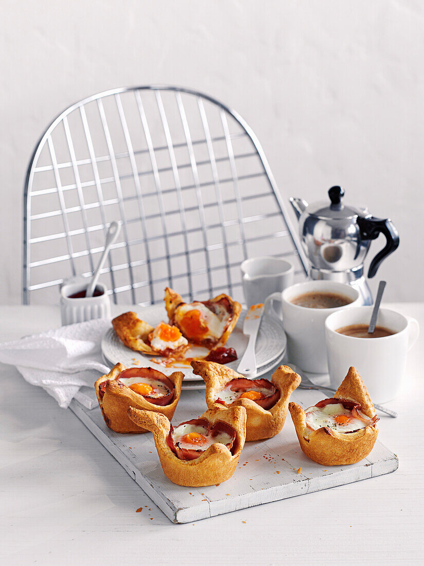 Eggs and ham baked in croissant cups