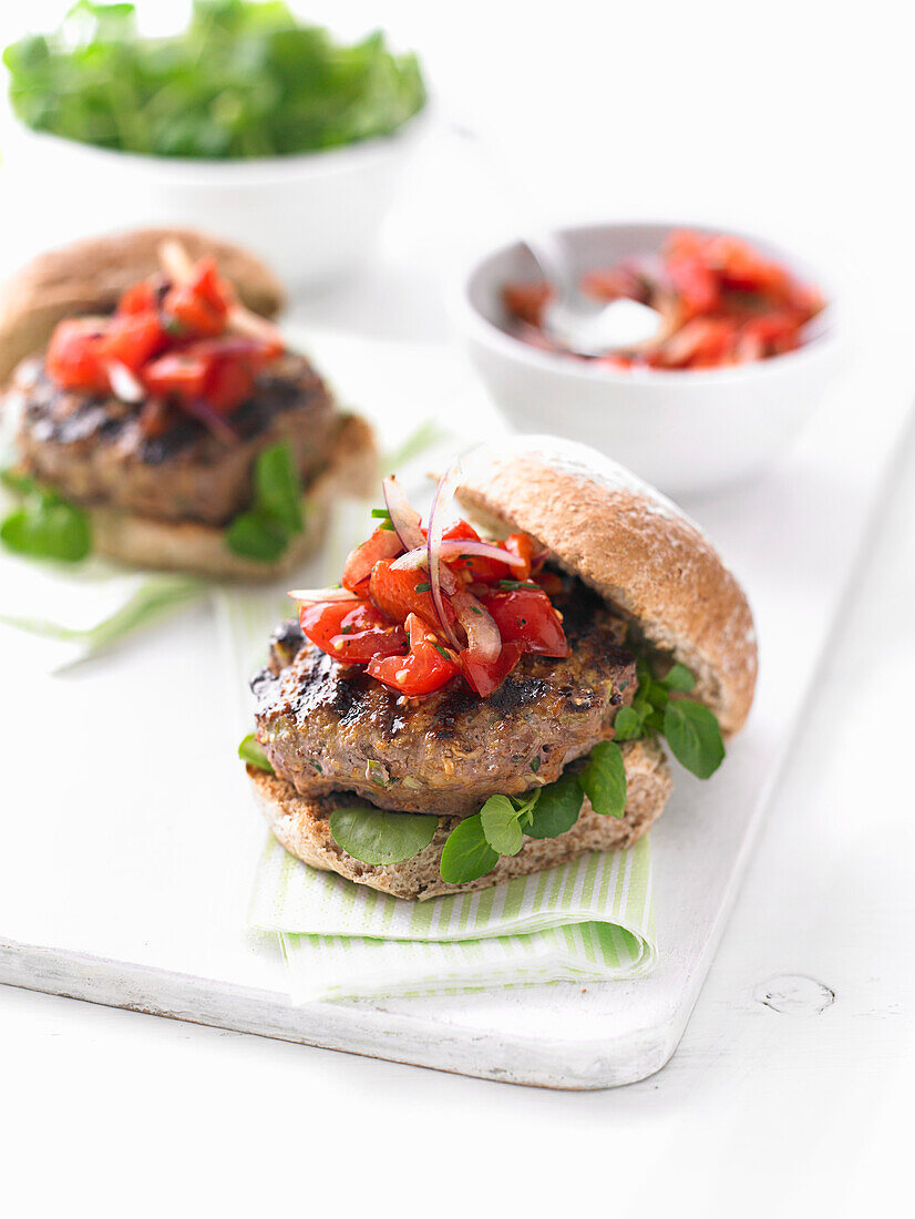 Beef burger with pepper salsa and watercress