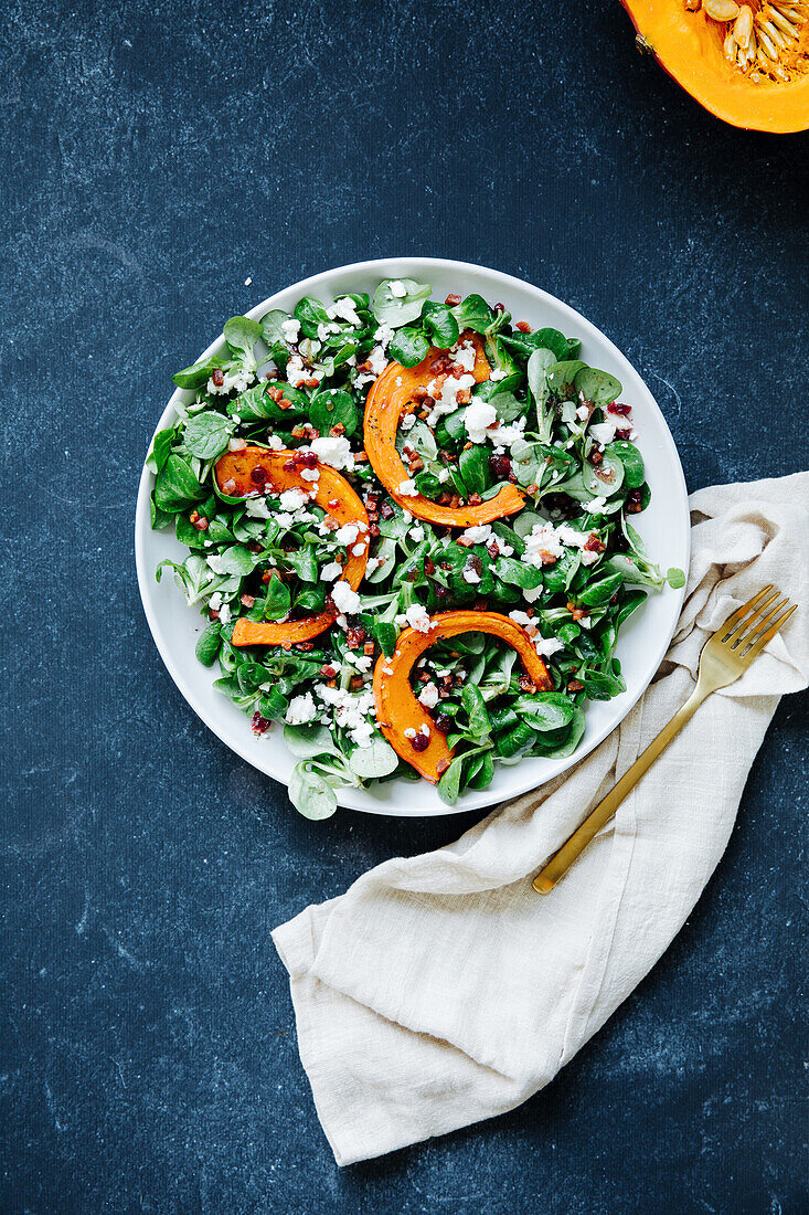 Lamb's lettuce salad with pumpkin, feta and bacon