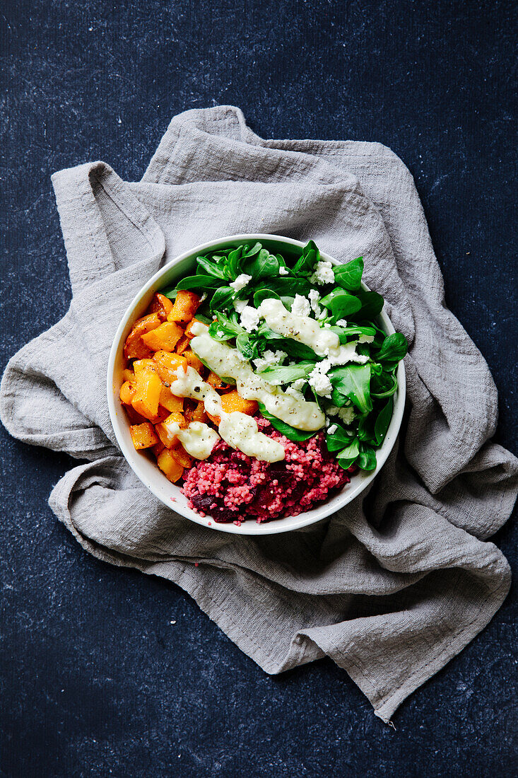 Winter bowl with pumpkin, beetroot couscous and lamb's lettuce