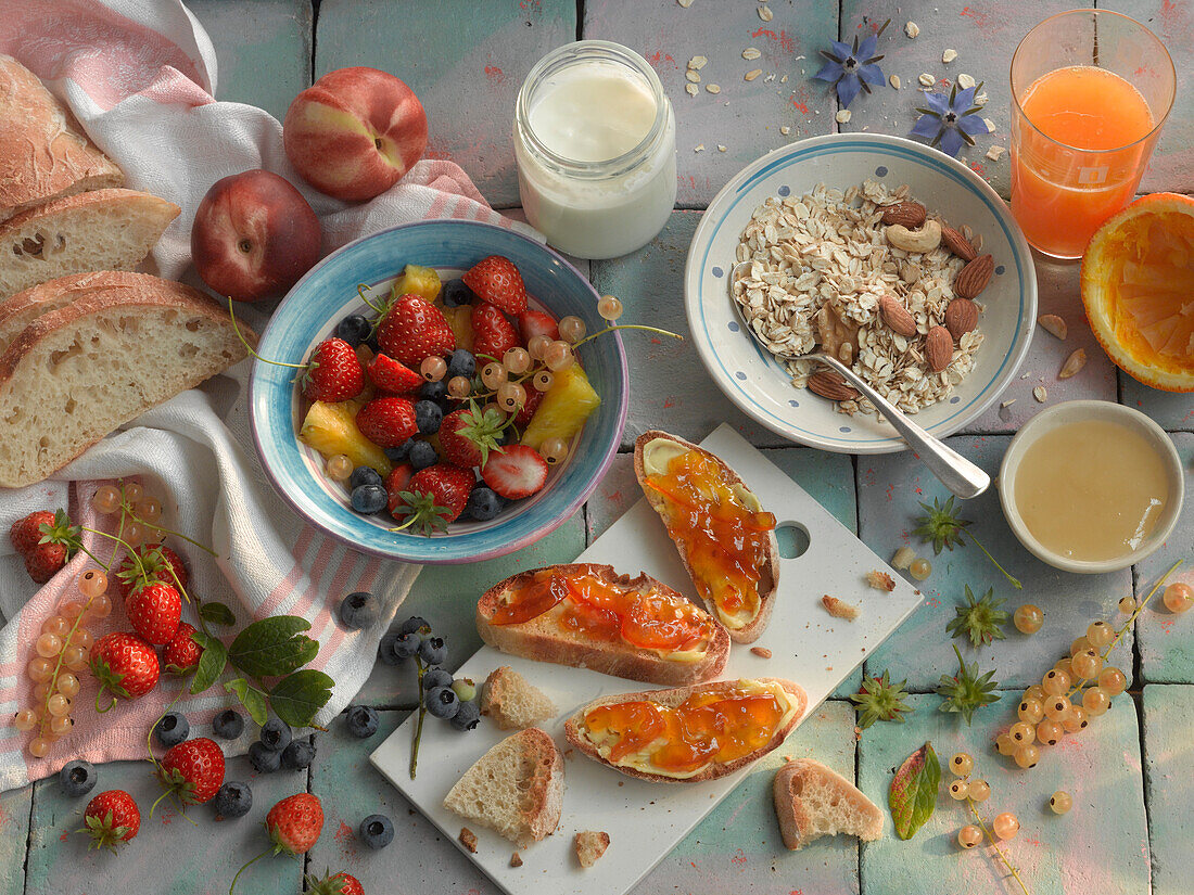 Healthy breakfast with muesli, jam on toast, and fruit