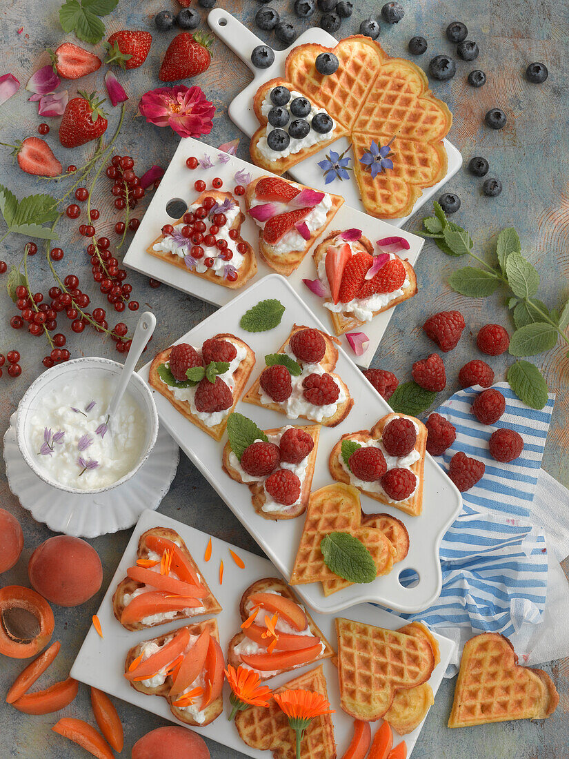 Heart shaped waffles with cottage cheese, berries, and apricots