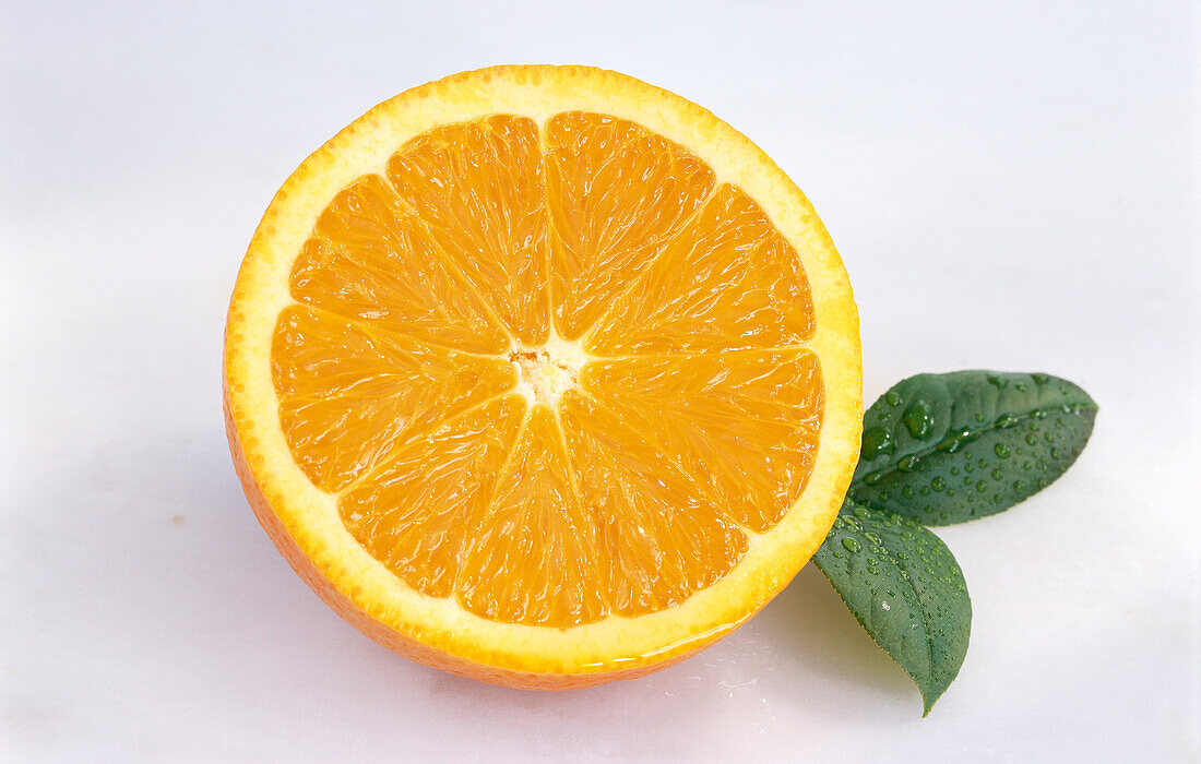 Orange half with leaves