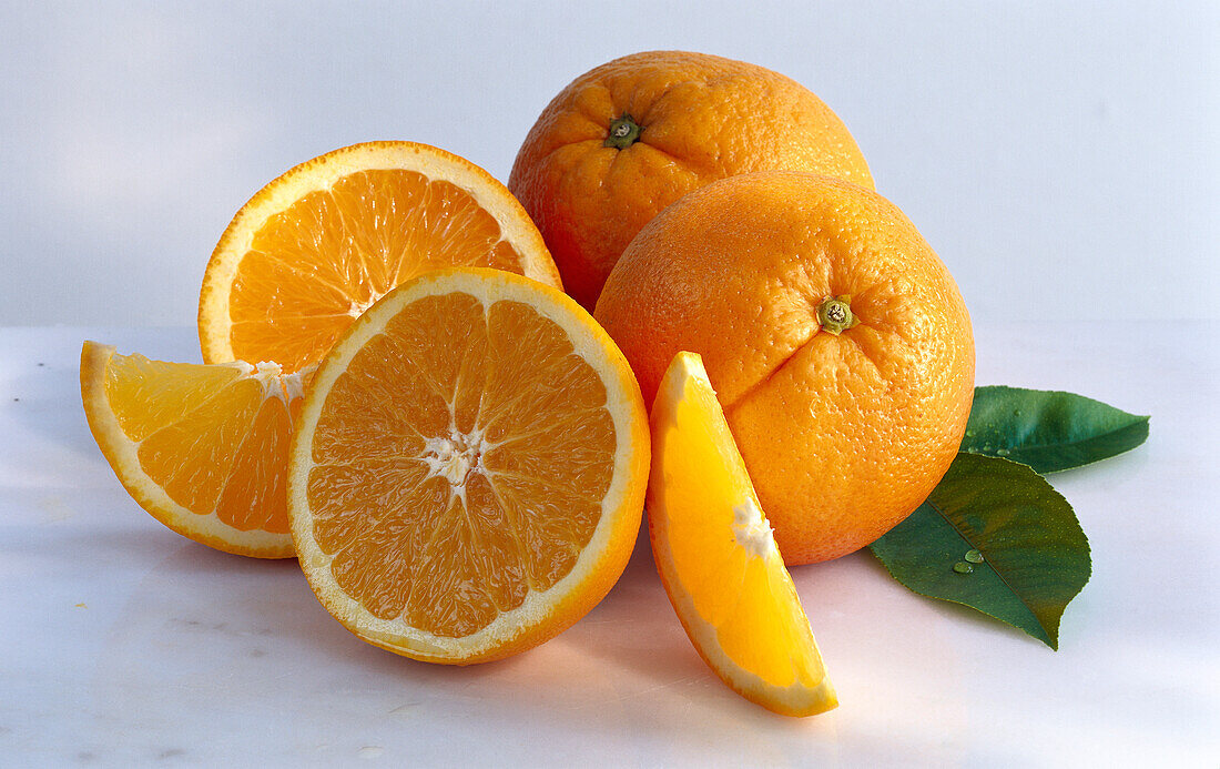 Whole oranges, orange halves and orange slices