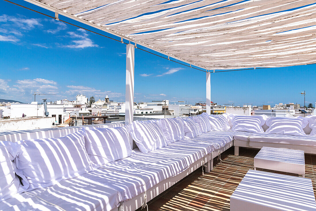 Terrace lounge with lounge furniture under pergola