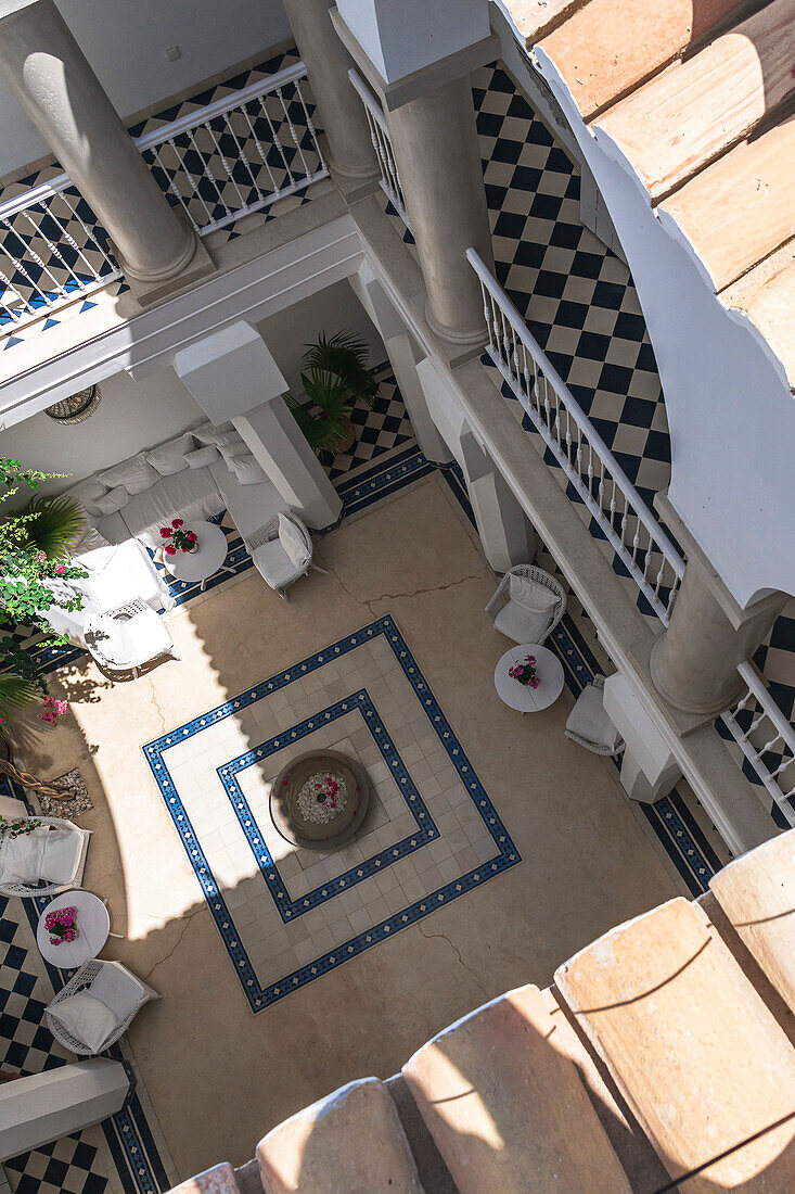 Moroccan-style patio with patterned tiles and plants