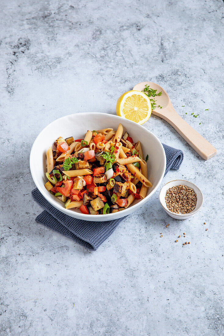 Asian pasta salad with tomatoes and eggplant