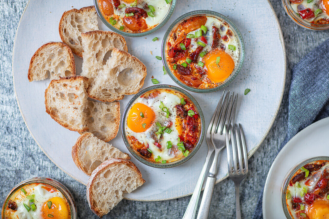 Baked Eggs with chorizo, tomatoes, peppers, and bread