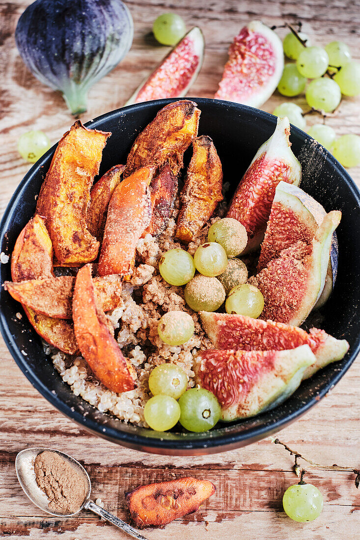 Vegan autumn bowl with quinoa and cinnamon pumpkin porridge