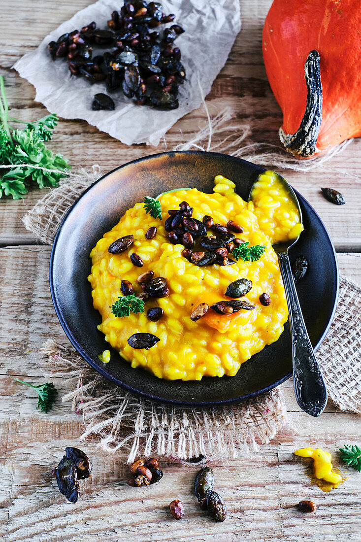 Vegan pumpkin risotto with crunchy roasted seeds and nuts