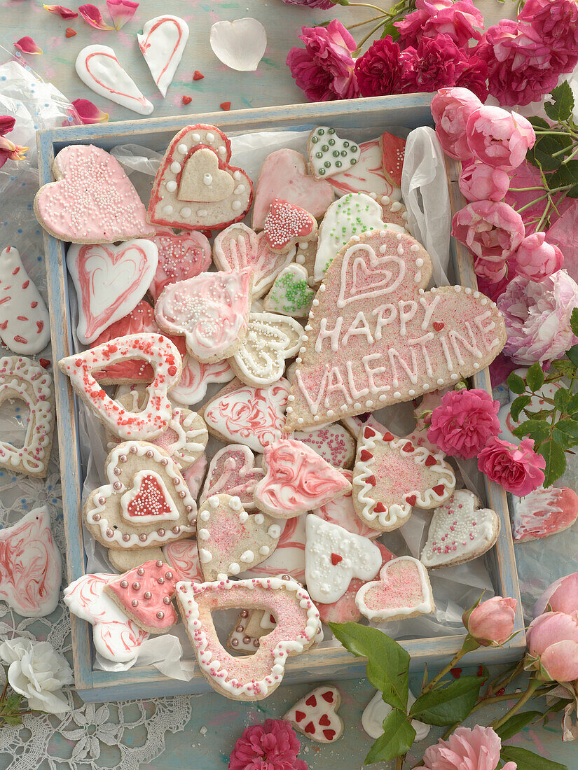 Heart-shaped cookies with sprinkles and royal icing for Valentine's Day