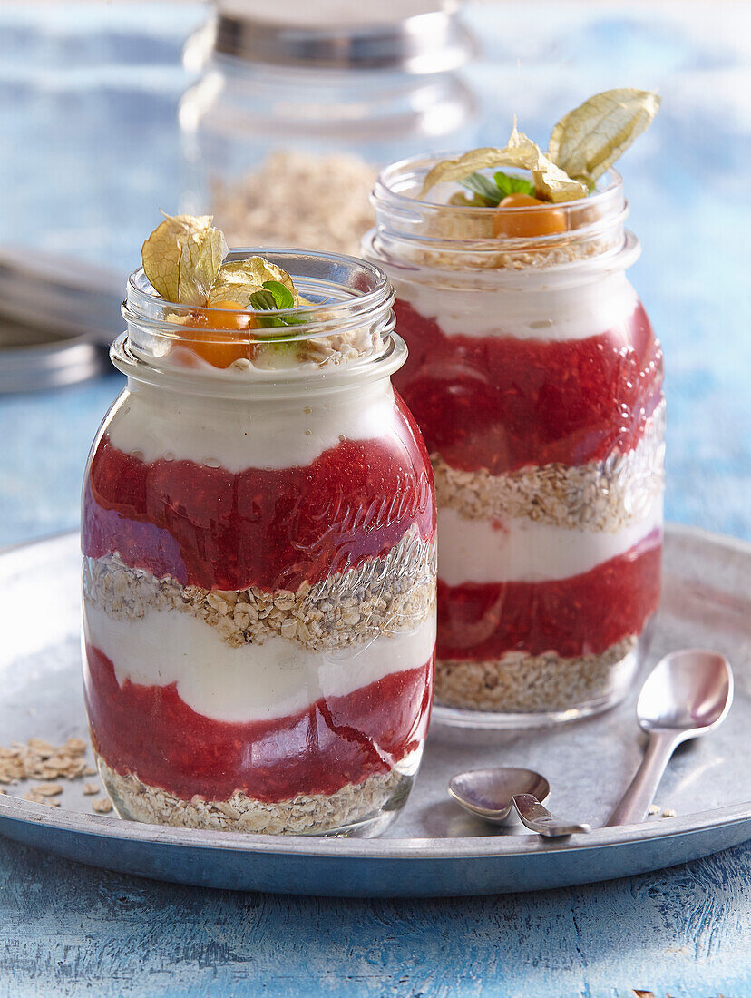 Layered dessert with yoghurt, fruit parfait and oatmeal in a glass