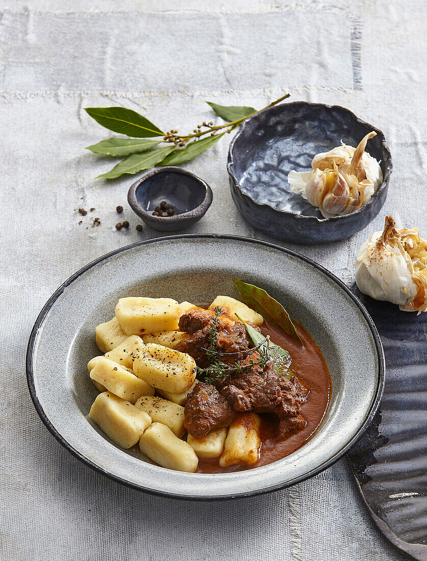 Beef stew with gnocchi and garlic