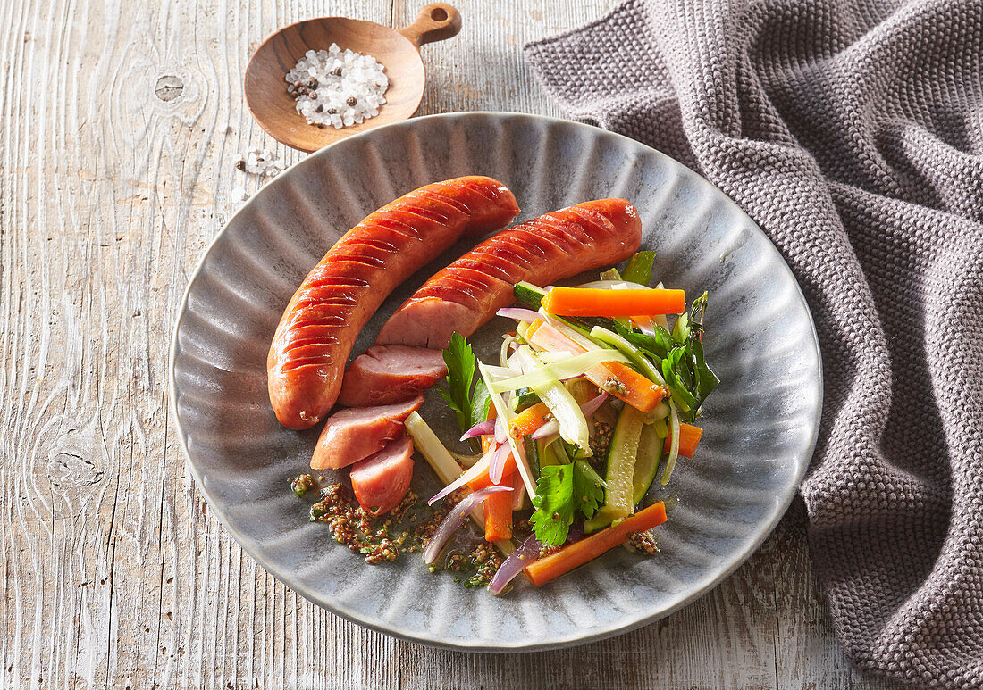 Grilled sausage with mixed vegetable salad