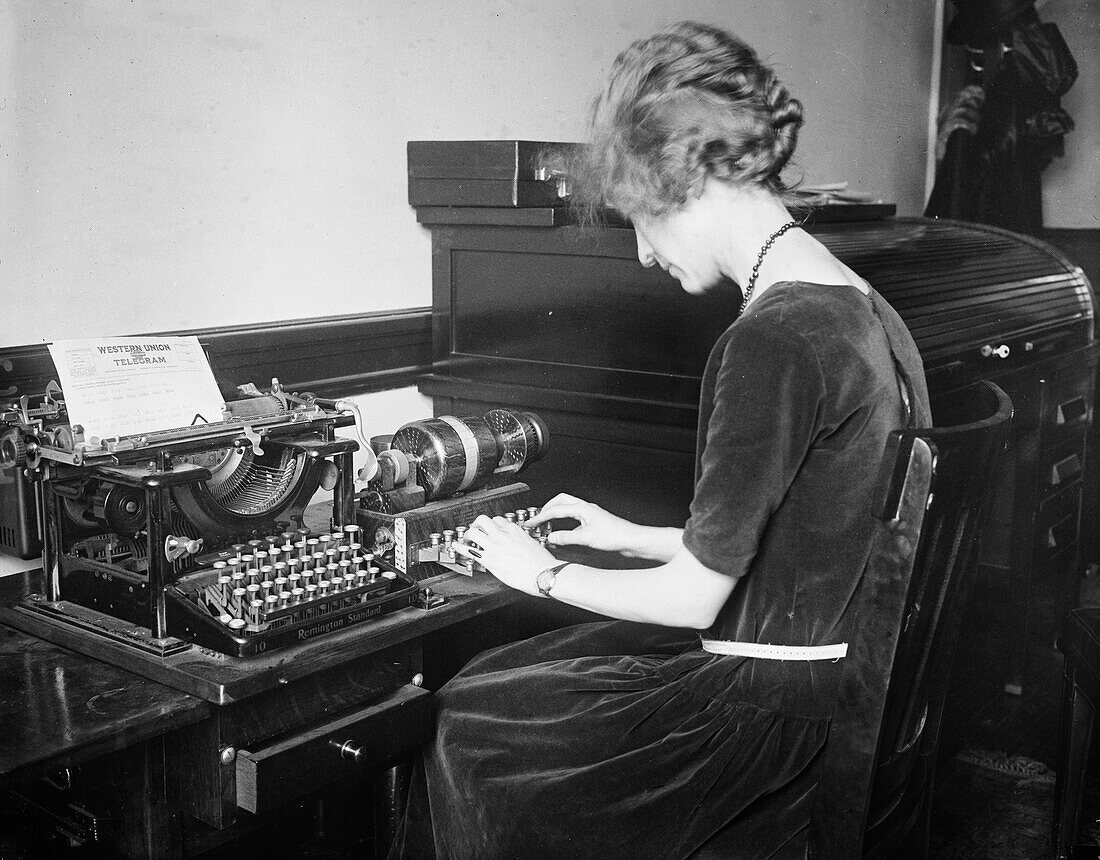 Telegraph operator using an electric code machine, 1923