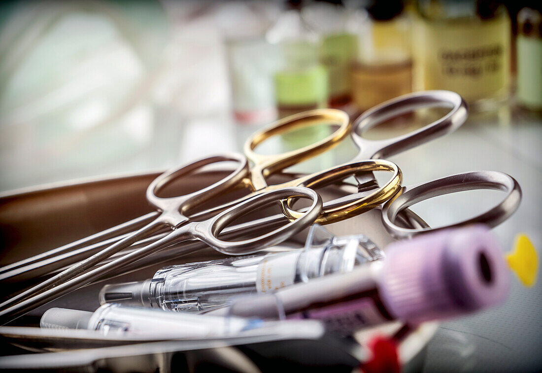 Phials and scissors in a laboratory, conceptual image