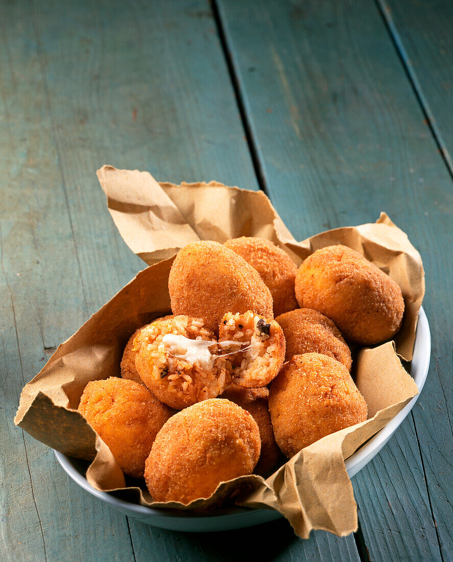 Suppli di Riso (Stuffed baked rice balls, Italy) with chicken liver and mozzarella cheese