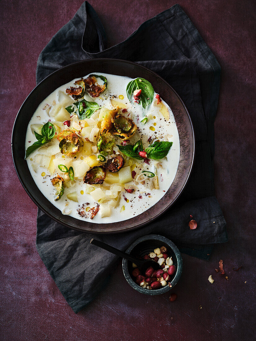 Kohlrabi and Coconut Soup with Crispy Breaded Brussels Sprouts and Peanuts