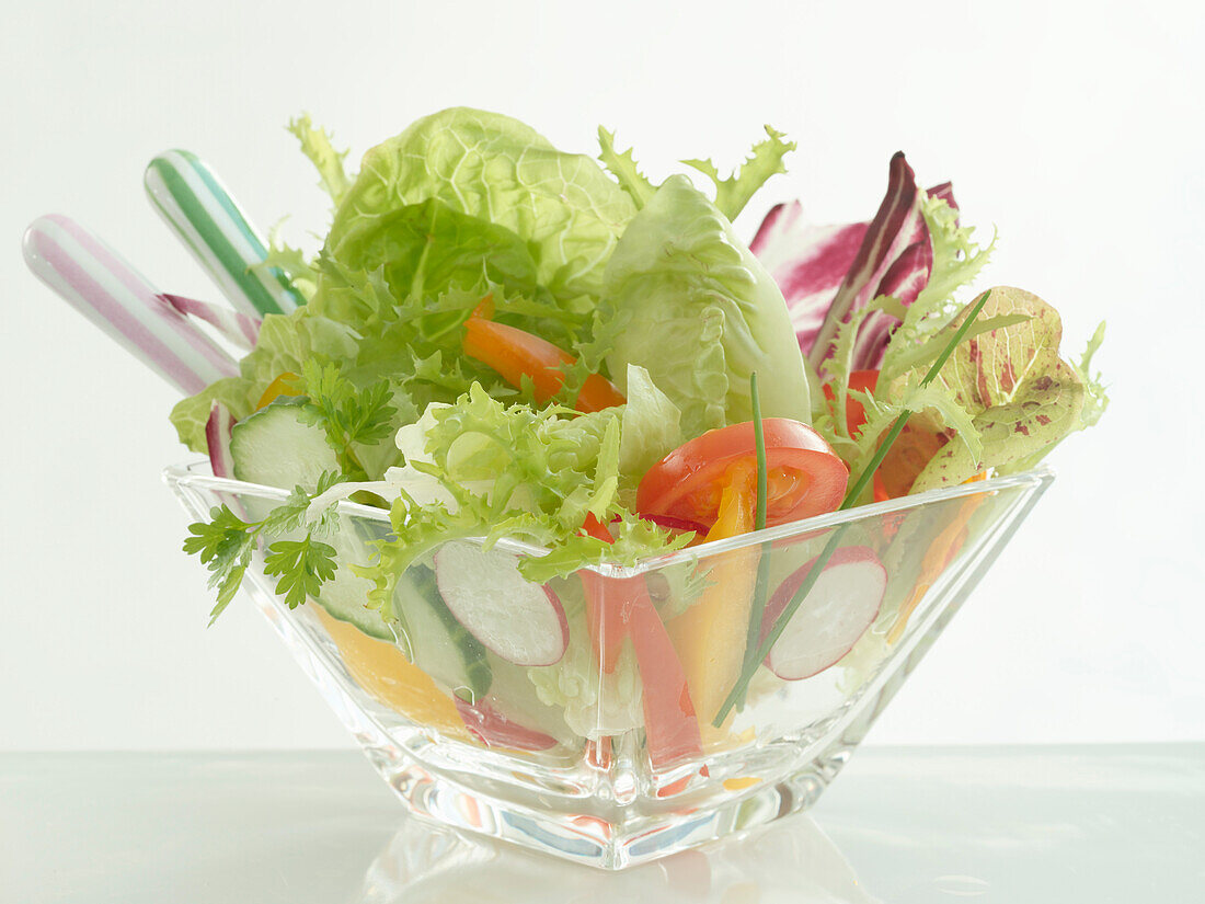 Mixed lettuce in a small glass bowl