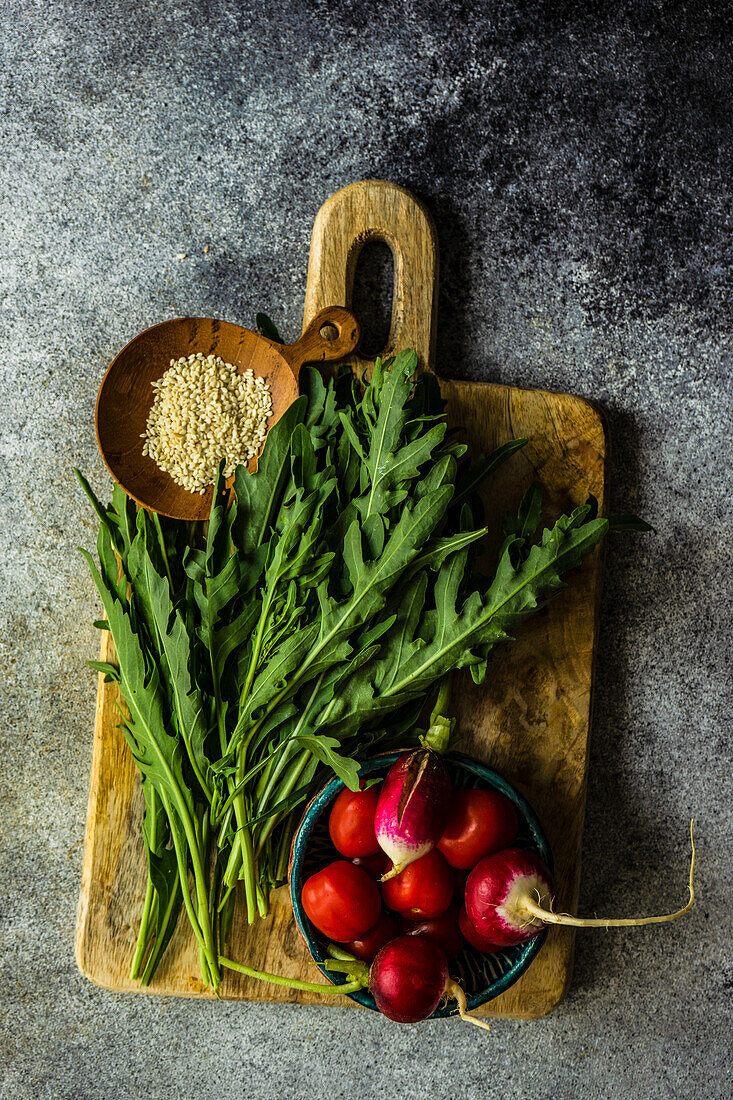 Organic vegetables - rocket and radish and sesame seeds for salad