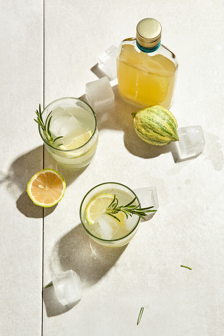 Homemade lemonade with tiger lemon ginger syrup, rosemary and ice cubes