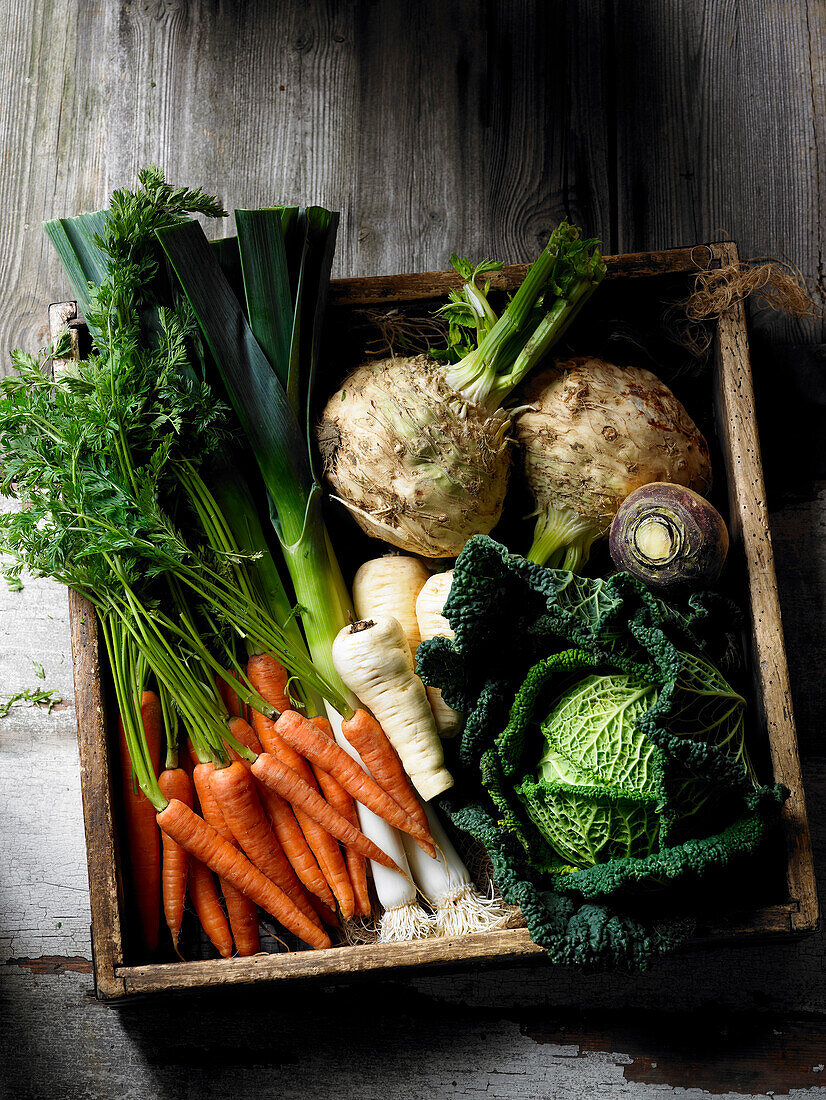 Fresh vegetables in a rustic wooden box