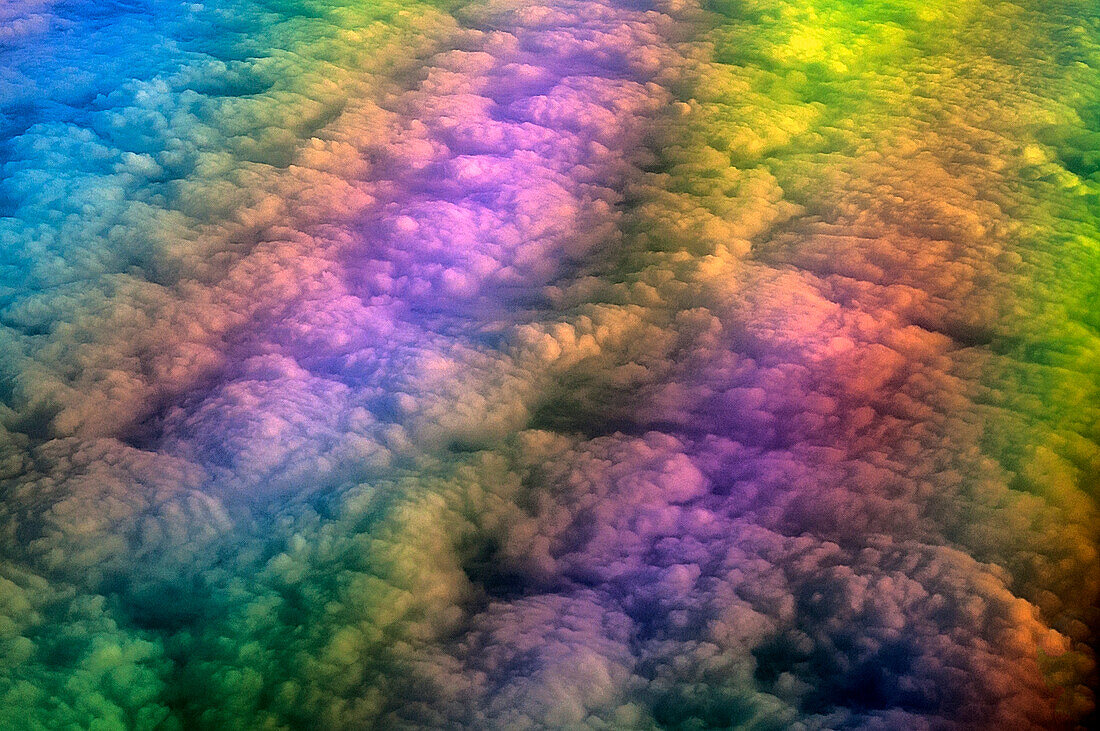 Clouds and refracted light from aeroplane window